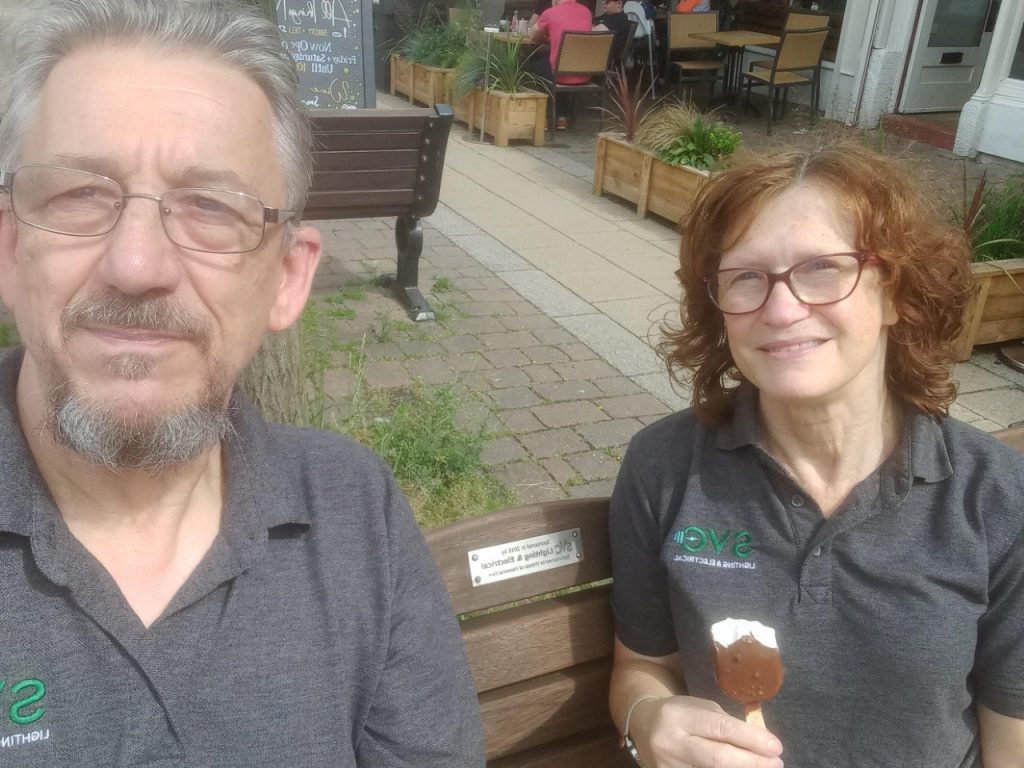 Simon & Carolyn sat on their sponsored bench eating iced lollies in the sun