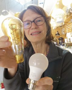 A lady holding 2 LED Lamp