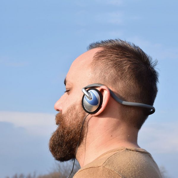 Man wearing Neckband Stereo Headphones
